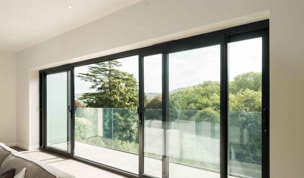 A 4-panel glass foldable sliding door creates a 10-ft clear opening with almost no visual barrier.