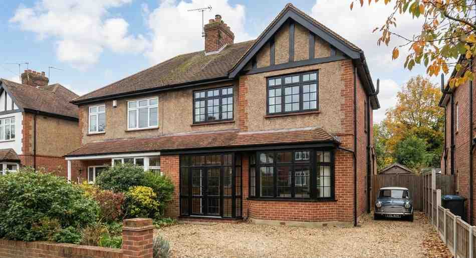 RAL 9005 black external finish on a 1937 semi – planning approved in 21 days because sightlines matched the originals